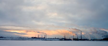 The industrial enterprise on a background of snowy mountains