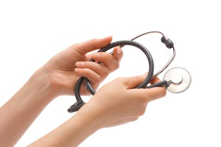 Stethoscope in female hands, isolated over whiteの写真素材