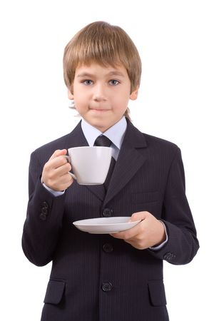 Boy in a business suit with a cup, isolated over whiteの写真素材