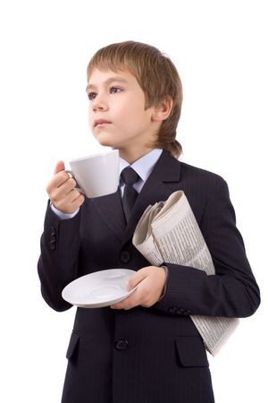 Boy in a business suit with a cup and newspaper, isolated over whiteの写真素材