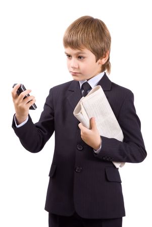 Boy in a business suit with a telephone, isolated over whiteの写真素材