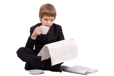 Boy in a business suit with a cup, isolated over whiteの写真素材