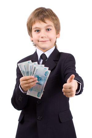 Boy in a business suit, holds  money in hands, isolated over whiteの写真素材