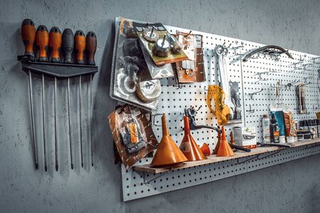 Inside the workshop. tools kit for working on the steel wall close-up. Workspace for mechanic with...
