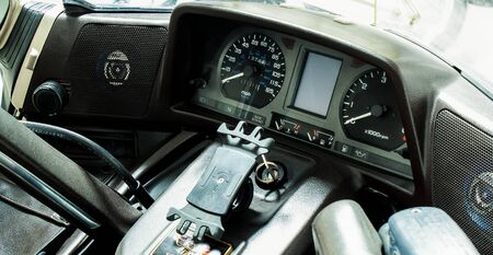 Dashboard of motorcycle steering wheel close-up. Moto handles, with windshield, mirrors, speaker,...