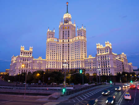 Stalin skyscraper on Kotelnicheskaya Embankment in Moscow, Russia. View of the high-rise building at dusk with the lights onの写真素材