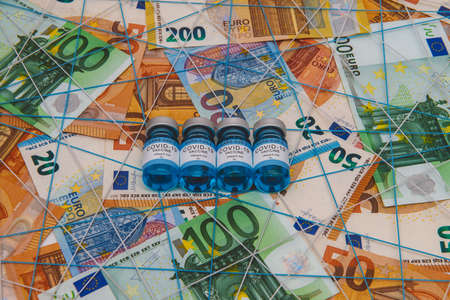 Concept for economy, finance, budget, investment and business, New year 2021, Covid-19 vaccination over the world, Euro banknotesの写真素材