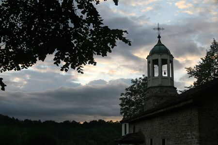 Landscape with church on a sunset backgroundの写真素材
