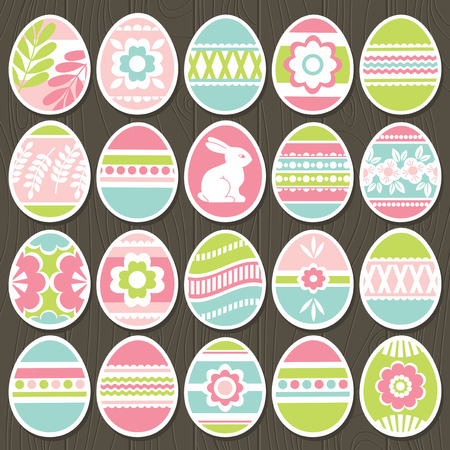 Set of color easter eggs over brown wooden background. Holiday Easter Eggs decorated with flowers, rabbit, leafs. Easter holidays. Print design, label, sticker, scrap booking, vectorのイラスト素材