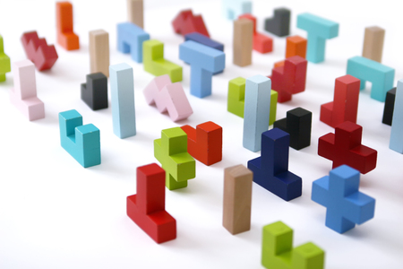 Wooden colored 3D geometric shapes arranged chaotic on a white background. Cover background template for the presentation, brochure, web, banner, catalog, poster, book, magazineの写真素材