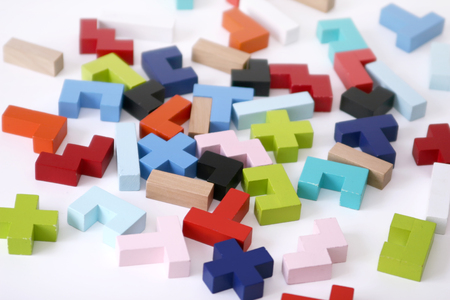 Wooden colored 3D geometric shapes arranged chaotic on a white background. Cover background template for the presentation, brochure, web, banner, catalog, poster, book, magazine の写真素材