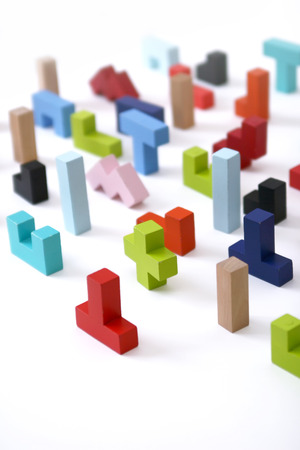 Wooden colored 3D geometric shapes arranged chaotic on a white background. Cover background template for the presentation, brochure, web, banner, catalog, poster, book, magazine の写真素材
