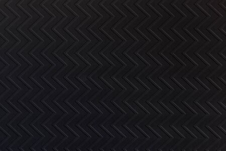 Black zigzag textured paper. Modern background suitable for any design.