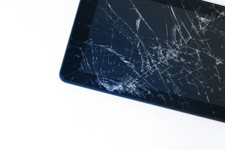 Photos of cracked display on a tablet  isolated on white. Tablet with damaged screen.の写真素材