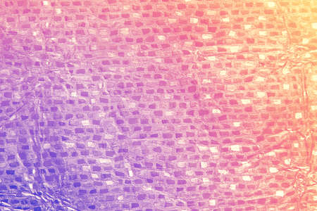 Shiny leaf color foil background suitable for any graphic design, poster, website, banner, greeting card, background. Purple foil texture.の写真素材