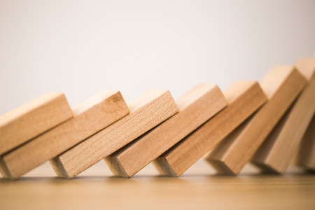 Domino effect shot on white backgroundの写真素材