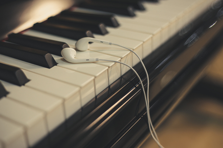 Headphones on the piano keyboardの写真素材