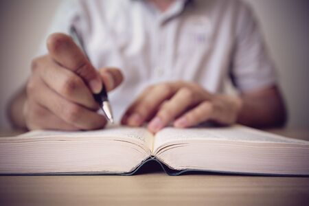 Writing on the bookの写真素材