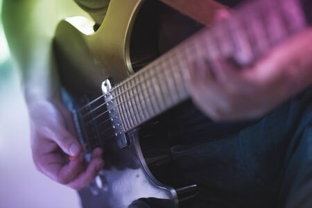 Close up of a man playing electric guitarの写真素材