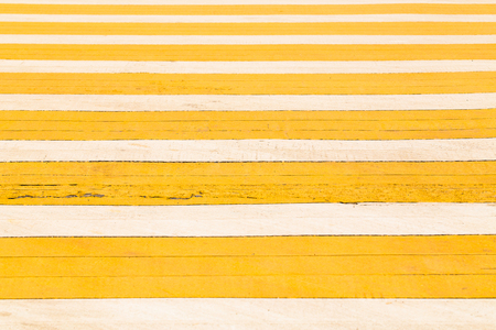 Yellow pedestrian crosswalk background.の写真素材