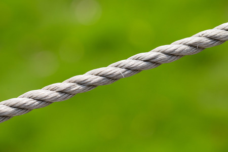 Rope isolated with green background.