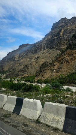 Mountain road in the mountains on a sunny day. Landscape.の写真素材