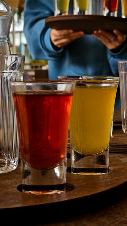 Tropical Tiki Cocktails with Exotic Garnishes
Description: Festive arrangement of colorful tropical cocktails in signature tiki mugs with pineapple wedges, orchid flowers and paperの写真素材