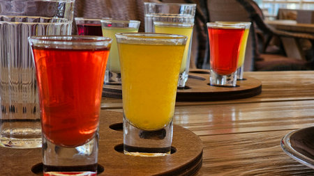 Botanical Gin Bar Station with Fresh Herbs
Description: Complete gin cocktail preparation station featuring copper shaker, botanical-infused gin bottles, fresh rosemary and thymeの写真素材