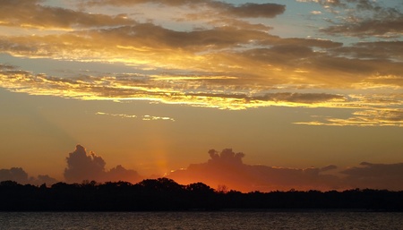 Colorfull Sunset in vicinity or Frazer Island with both Cumulus and Stratocumulus clouds highlighted. This photograph was taken over tropical water Queensland-Australia.の写真素材