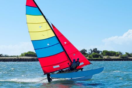 Sailing cat competing in race on the Burnett River Bundaberg staged by the Bundaberg Sailing Club.  Queensland - Australia.の写真素材