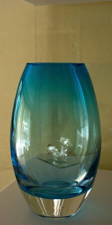 Blue Glass Vase with silver base and reflections.の写真素材