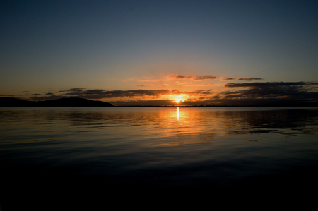Gold and grey sunrise seascape with water reflections in the tranquil waters of Lake Macquarie at dawn.
New South Wales, Australia.の写真素材
