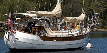 A blue water sailing yacht moored in the protected  waters of Bantry Bay, Middle Harbour, Sydney, October 2013.の写真素材