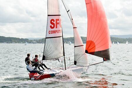 Lake Macquarie, Australia - April 17. 2013: Children competing in the Australian Combined High School Sailing Championships. Young contestants raced in various types of dinghies.のeditorial素材