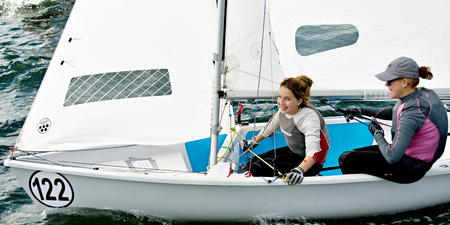 Lake Macquarie, Australia - April 16. 2013: Children competing in the Australian Combined High School Sailing Championships. Young contestants raced in various types of dinghies.のeditorial素材