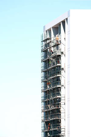 Building work series, progress on the new high rise apartments construction at 277 Mann St, Dismantling the scaffolding on the structure. External view. Commercial use image. Gosford, Australia - May 19 , 2020:のeditorial素材
