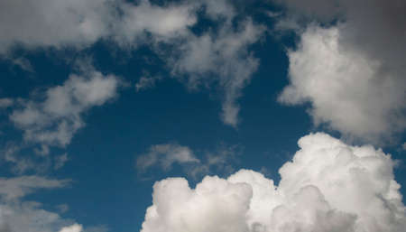Nephology at its best. A sky cloudscape scene, with white Cumulus cloud formation in a mid blue sky. Atmospheric beauty in nature. New South Wales, Australia.の写真素材
