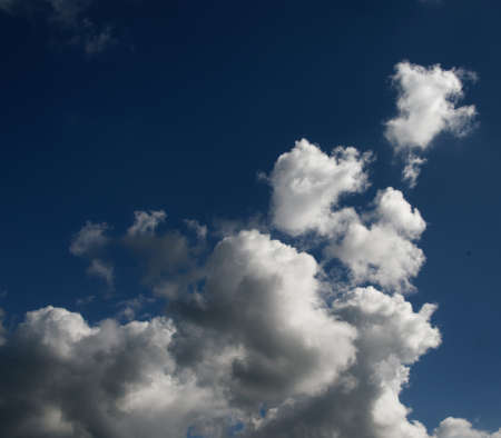 A spectacular vibrant sky cloudscape scene, with white coloured billowing cumulonimbus cloud formation in a cobalt blue sky. Atmospheric beauty in nature. New South Wales, Australia.の写真素材