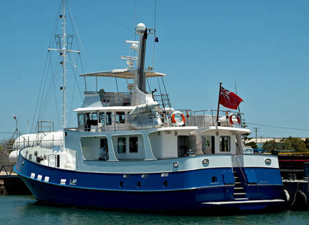 Luxury motor yacht docked at Tin Can Bay, Queensland, Australia.の写真素材