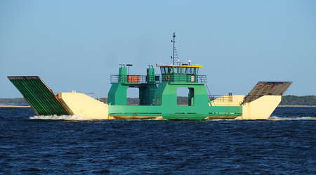 Ferry for Off  Road Car Transport under way from mainland Australia to tropical Frazer Island. Inskip Point, Sandy Straits, Queensland, Australiaの写真素材