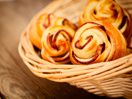 Tasty homemade apple cakes over wooden backgroundの写真素材
