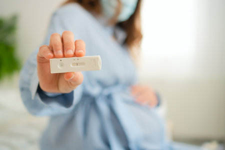 Mom-to-be examining polymerase chain reaction test results. Crucial infection screening for maternal...