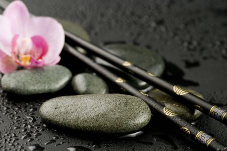 Still life asian style with chopsticks and pebbleの写真素材