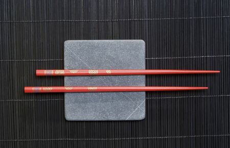 Asia still life with square stone slab and chopsticksの写真素材