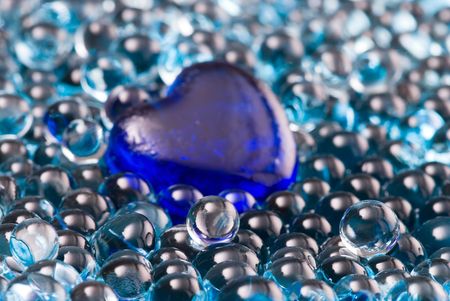 blue glass heart in shiny jelly decoration ballsの写真素材