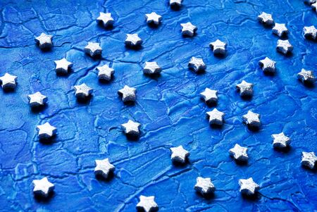 silver stars on blue background