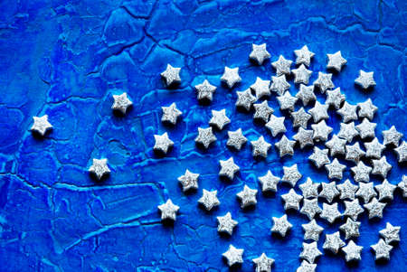 silver stars on blue background