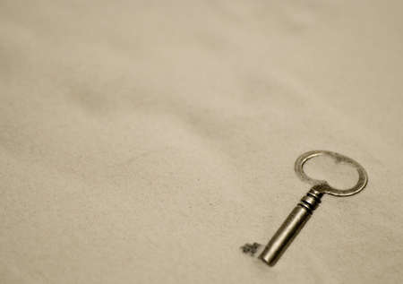 key in the sandの写真素材