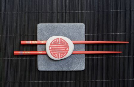 Asia still life with square stone slab and chopsticksの写真素材