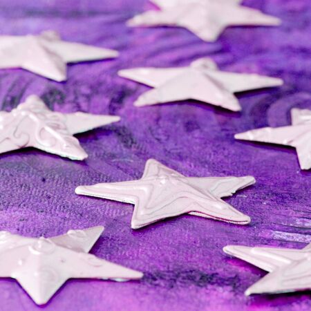 Christmas stars on purple background